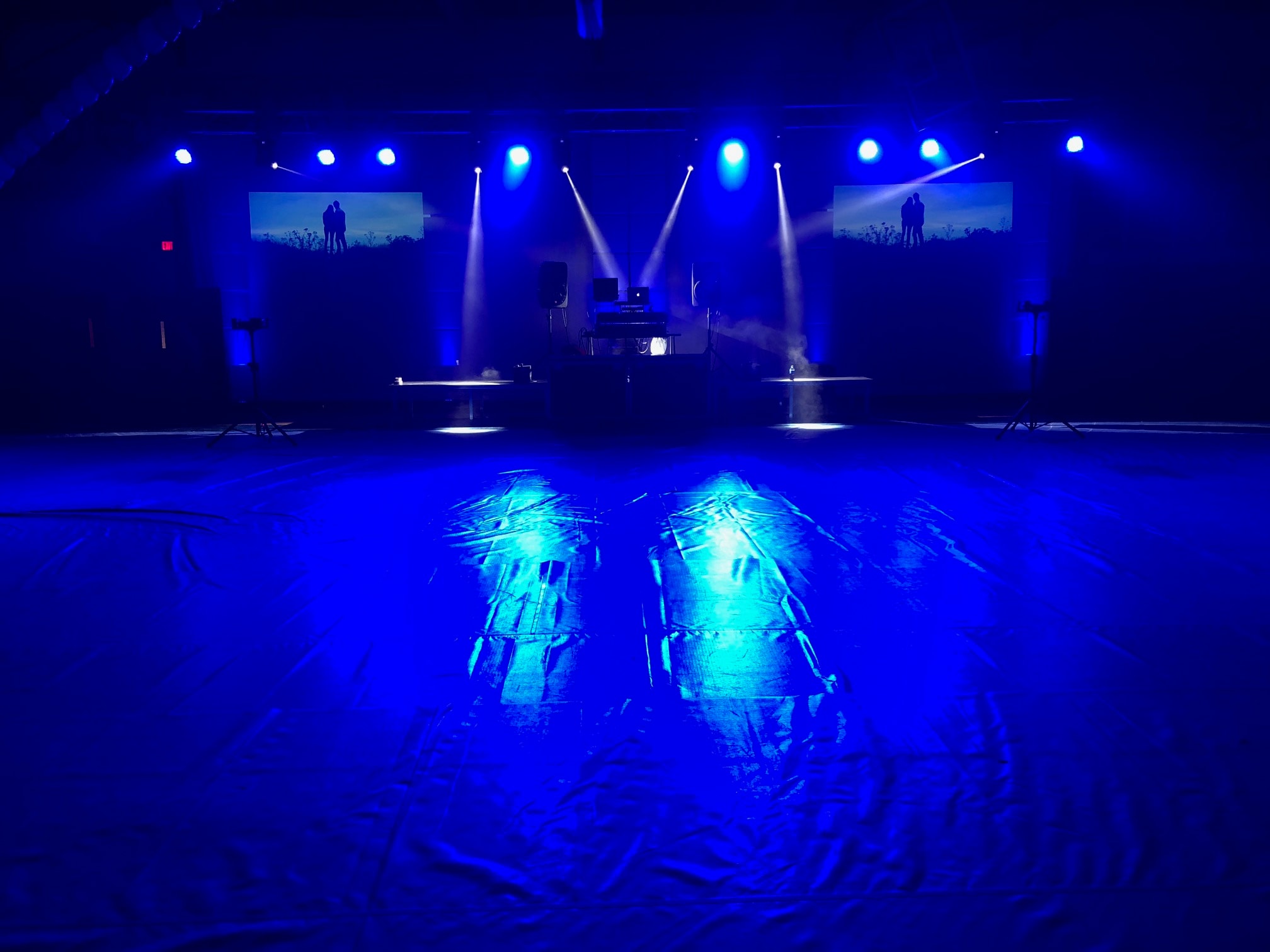 Performer spraying the crowd with colorful lights and smoke at GloZone HTown 2016