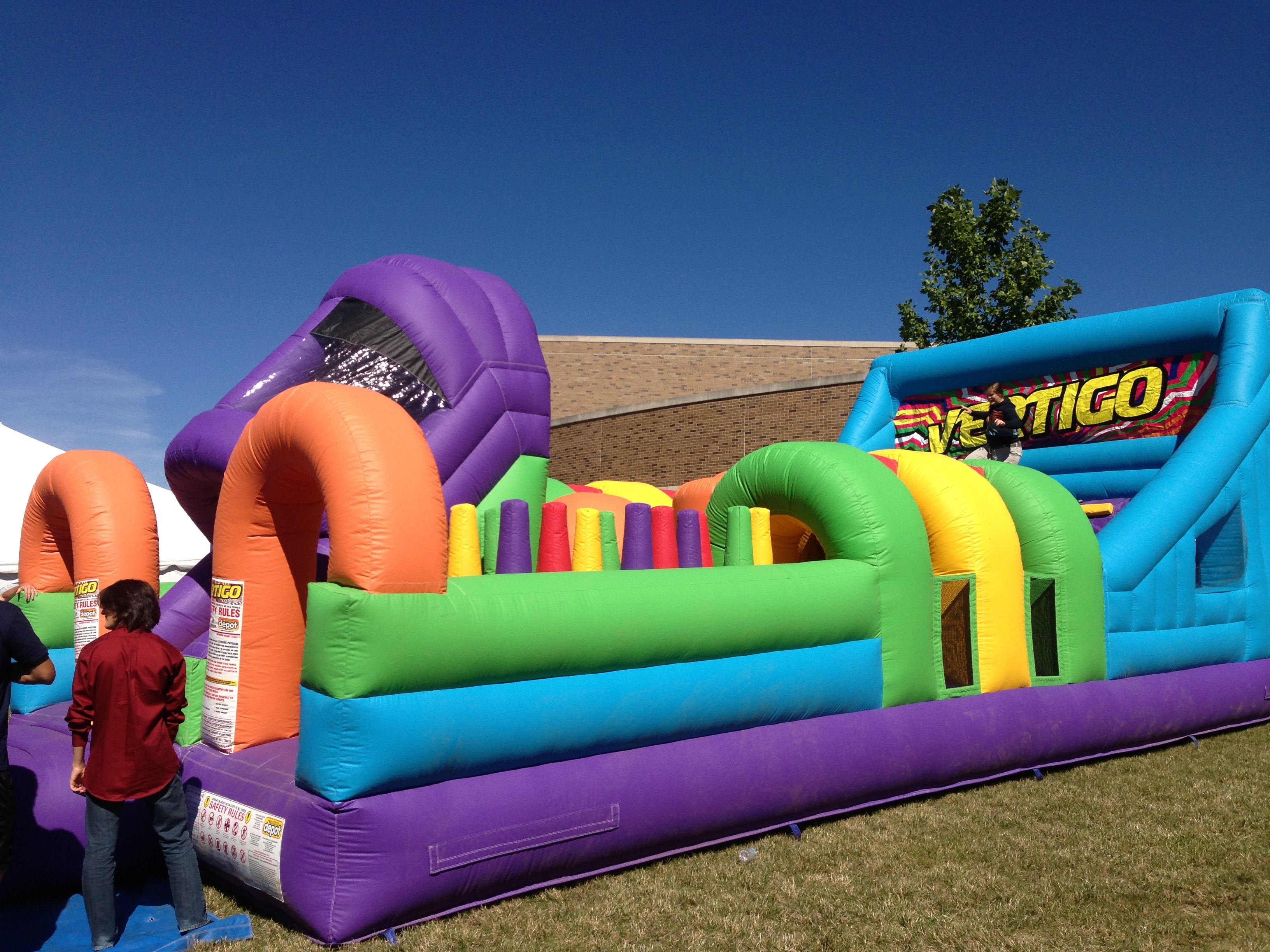 Vertigo inflatable obstacle course at an outdoor event